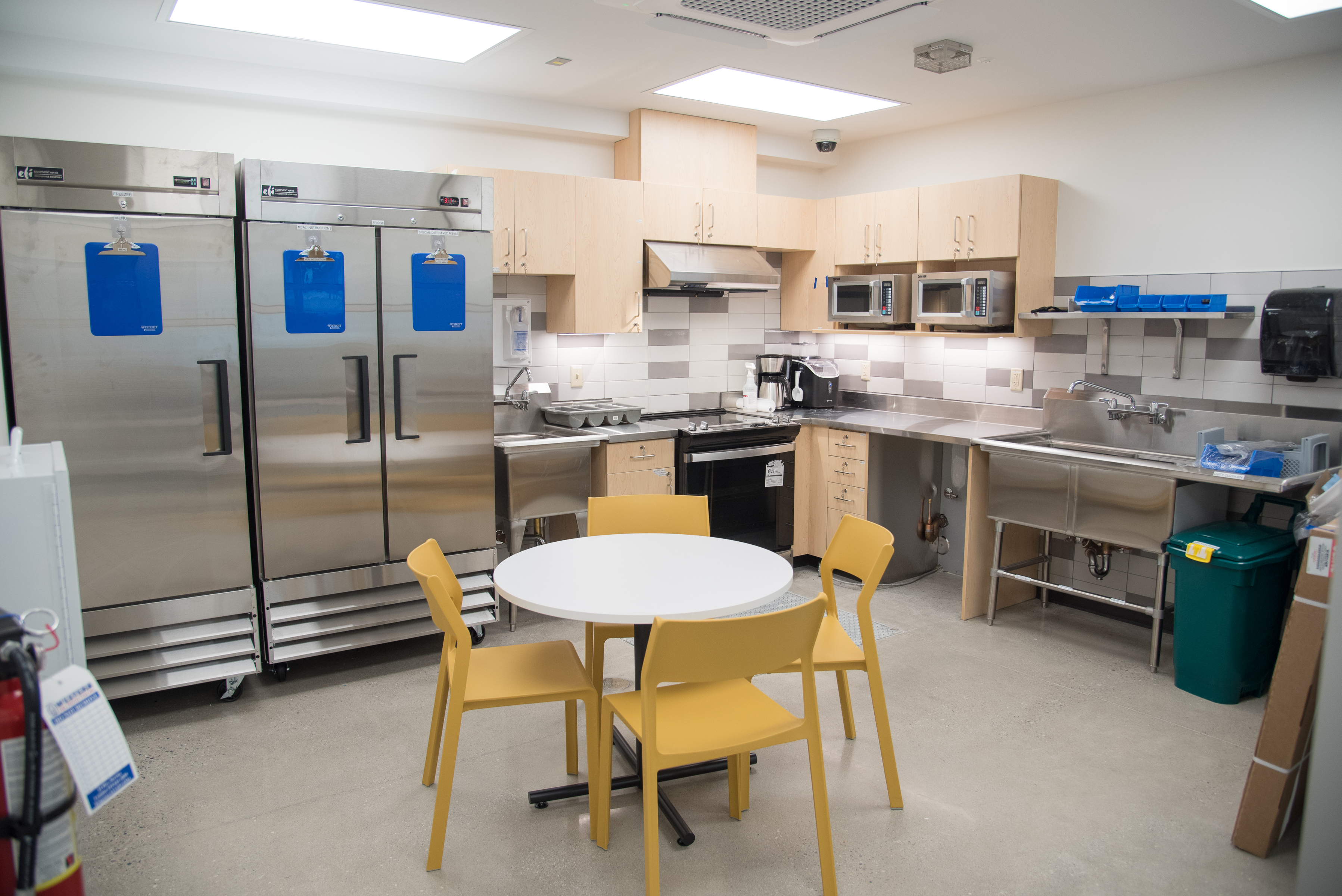 Kitchen with small table and 4 chairs.