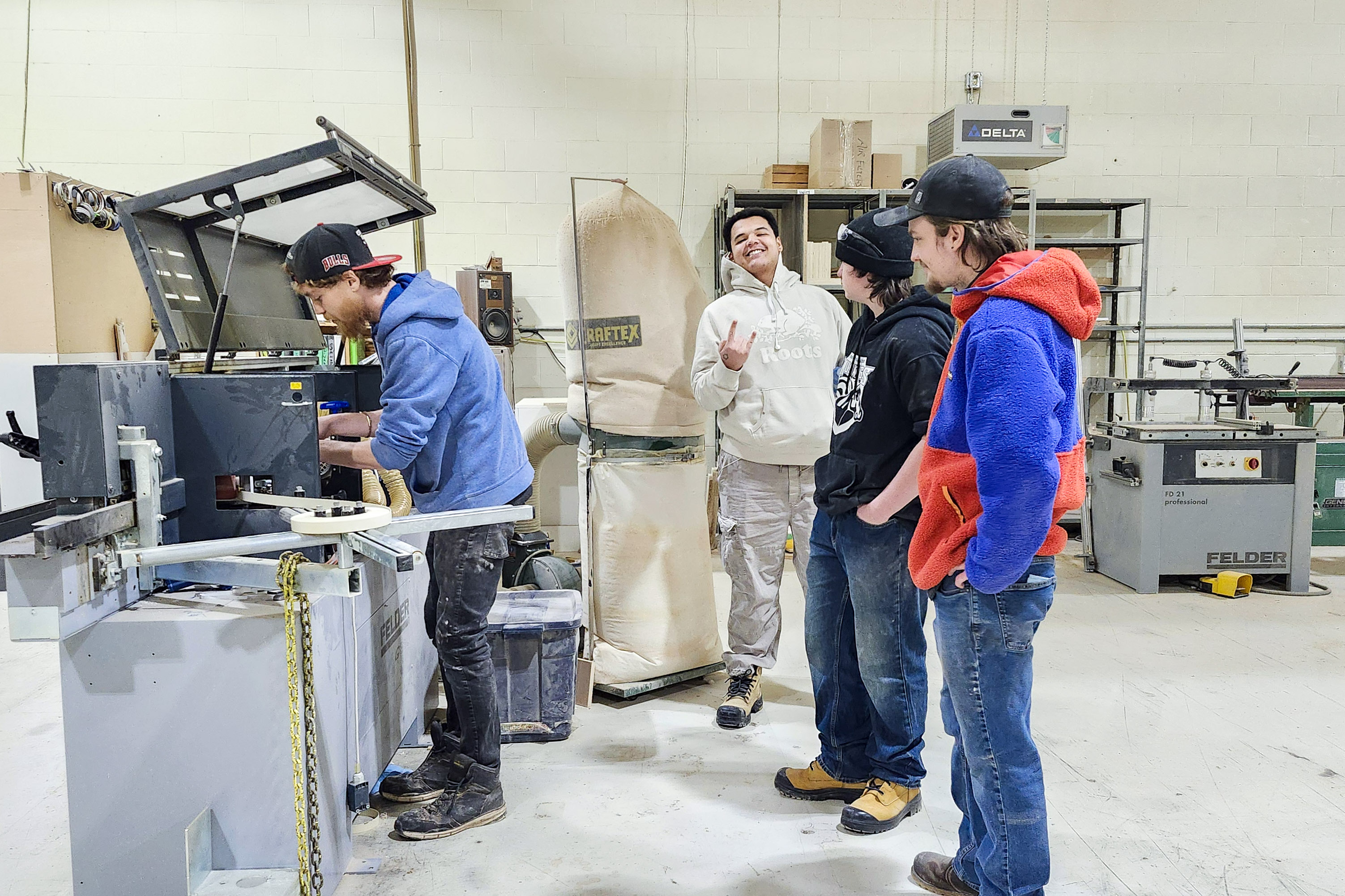 Youth watching mentor at woodshop